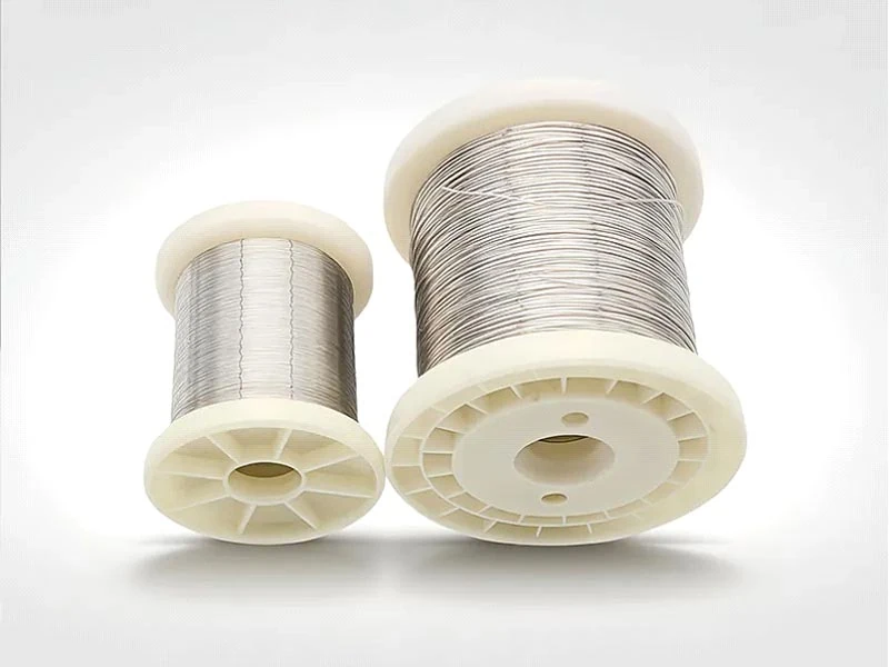 Two spools of Cr20Ni80 nickel-chromium resistance wire, high ductility NiCr heating alloy wire for industrial heat treatment furnaces with stable thermal cycling performance banner